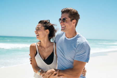 Young couple with smooth skin enjoying the beach